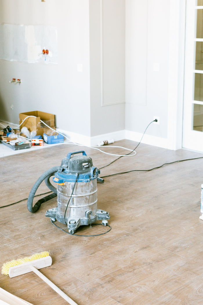 Cleaning equipment in a room undergoing post-construction cleanup